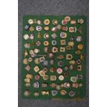 A good collection of enamel badges, framed and glazed.