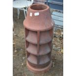 A large terracotta chimney pot.