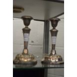 A pair of plated candlesticks.