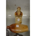 A salt glazed fish shaped bottle, stamped Garrett Wine & Spirit Merchant, 1 King Street, Tower Hill,