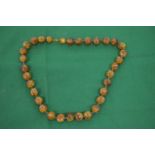 A good small amber bead necklace of large beads.