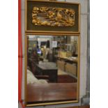 A small Chinese gilt framed mirror with carved decoration.