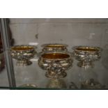 A good set of four Neo Classical style cast silver and silver gilt pedestal salts.
