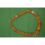 A good graduated amber bead necklace.