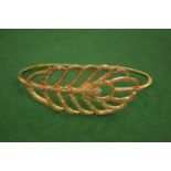 A decorative leaf shaped bangle.