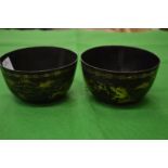 A pair of Chinese lacquer bowls.