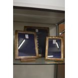 A set of three Hallmark silver photograph frames.