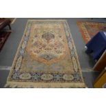 A Persian carpet, cream ground with stylised decoration, 219cm x 138cm.