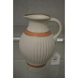 A classical revival painted and gilt decorated parian china jug.