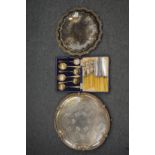 Two silver plated salvers, cased set of six fruit spoons and six fish knives and forks.