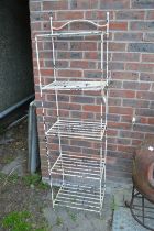 A wrought iron five tier plant stand.