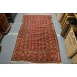 A Persian bokara rug, 195cm x 114cm.