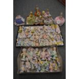 A large collection of porcelain pin dollies.