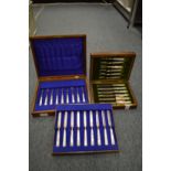 Two cased sets of silver dessert knives and forks with mother of pearl handles.