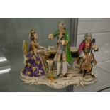 A large Dresden porcelain centre piece of three musicians.