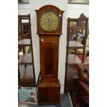 A 19th century mahogany longcase clock with circular brass dial.