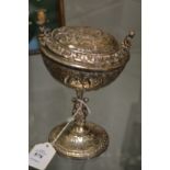 A silver plated chalice and cover.