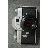 A Leicaflex camera and a Zenit 3M camera.