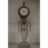 A cut glass and ormolu clock.