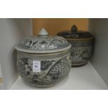 Two Oriental blue and white jars and covers.