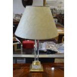 A brass and perspex lamp.