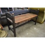 A small oak bench seat.