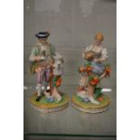 A pair of Dresden figures of a male and female gardener.