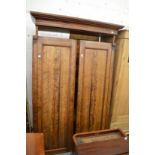 A Victorian pitch pine two door wardrobe.
