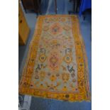 A Persian style woollen rug, 210cm x 110cm.