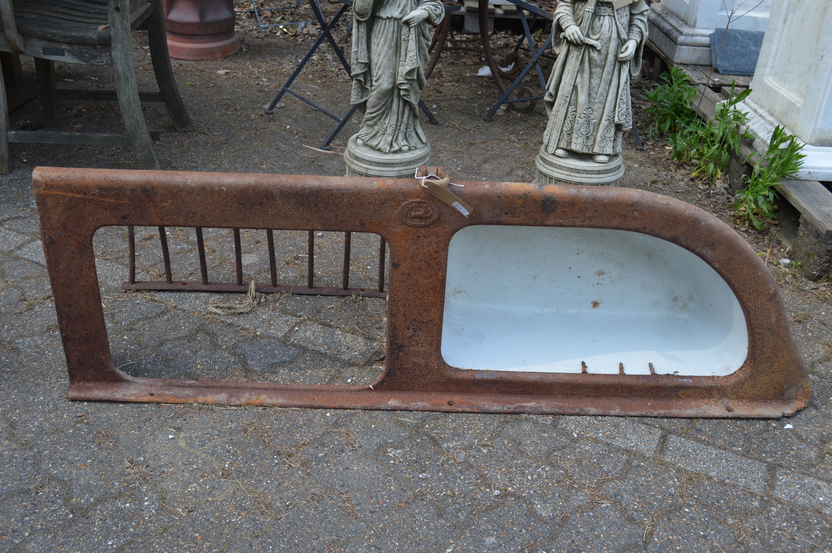 An unusual cast iron and enamel combination hay manger and water trough.