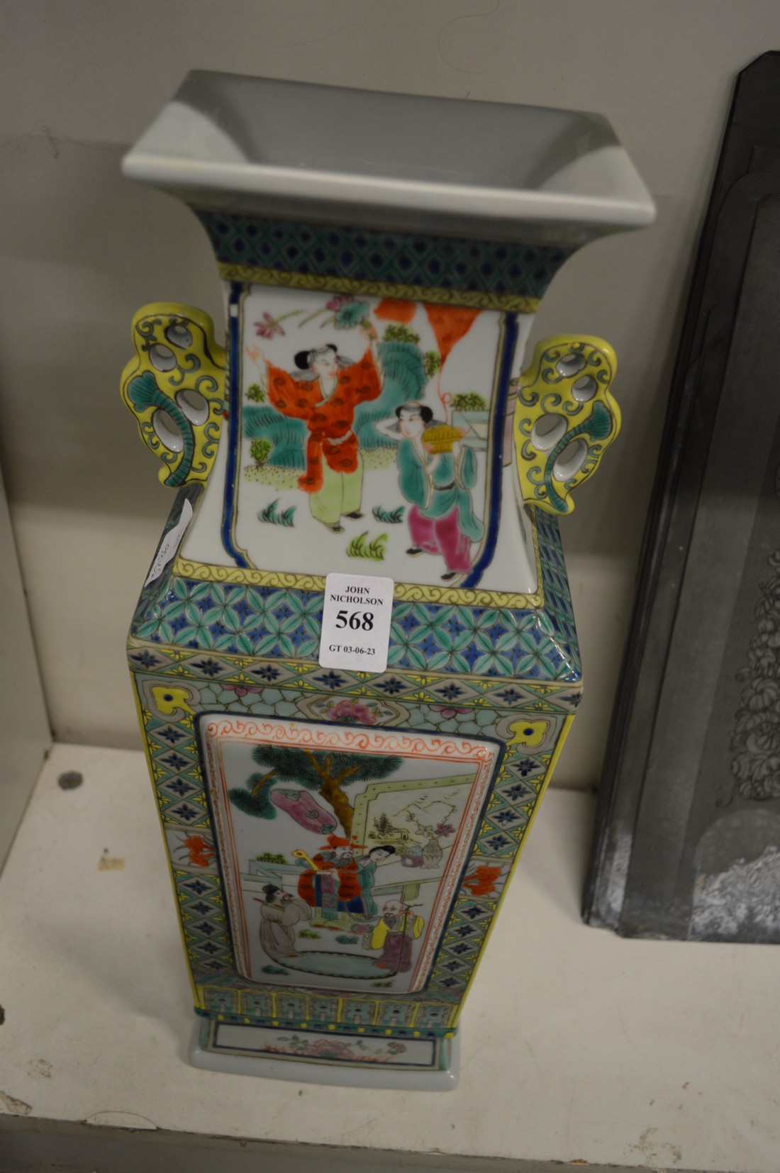 A Chinese famille jaune tapering square shaped vase.