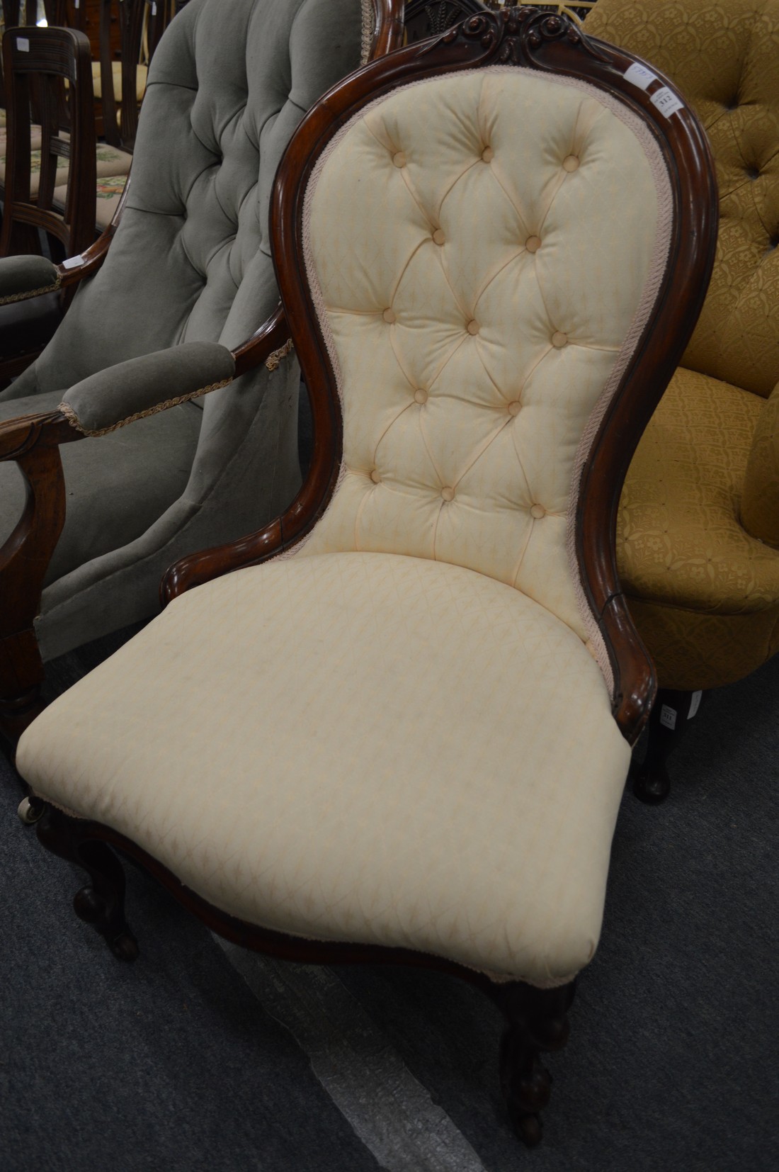 A Victorian button upholstered mahogany framed nursing chair.