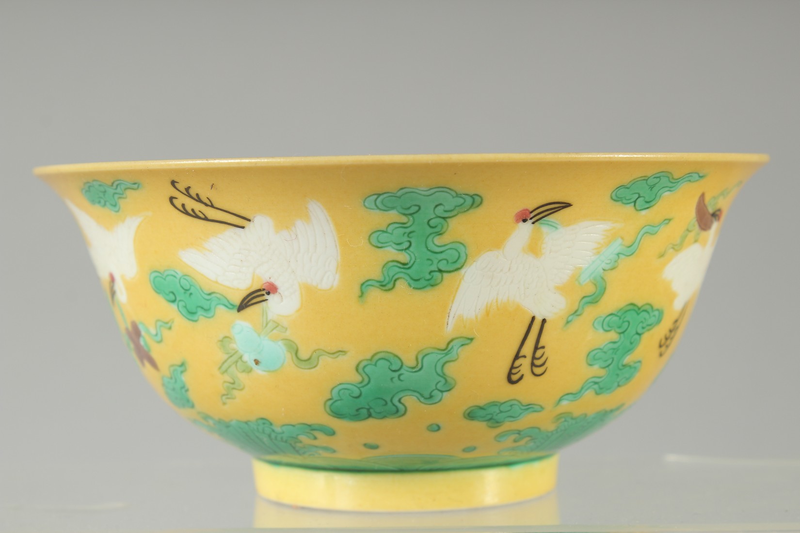 A CHINESE YELLOW GROUND ENAMELLED CRANE BOWL, with longevity symbol to interior and character mark - Image 3 of 7