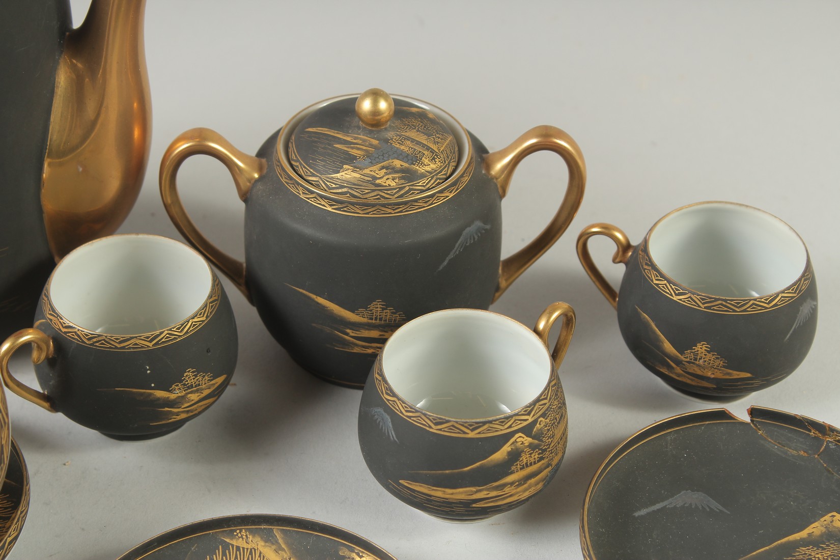 A GOOD JAPANESE BLACK AND GILT PORCELAIN TEA SET, comprising teapot, jug, sugar bowl, and six cups - Image 4 of 6