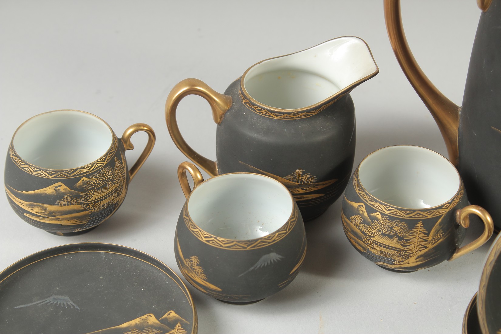 A GOOD JAPANESE BLACK AND GILT PORCELAIN TEA SET, comprising teapot, jug, sugar bowl, and six cups - Image 2 of 6