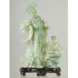 A CHINESE CARVED JADE FEMALE FIGURE ON STAND, jade 21cm high.