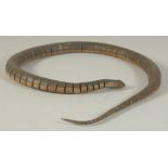 AN EASTERN CARVED AND HAND PAINTED ARTICULATED WOODEN SNAKE, 84cm long, in original fitted box.