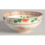 AN EARLY 20TH CENTURY JAPANESE ENAMELLED PORCELAIN BOWL, the interior with phoenix and