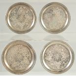 A SET OF THREE ISLAMIC ENGRAVED SILVER CIRCULAR COASTERS, 7cm diameter, weight 140g, (3).