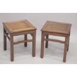 A PAIR OF CHINESE HARDWOOD SQUARE-FORM STANDS, 48cm high.