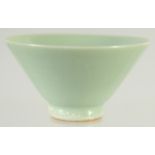 A CHINESE MINIATURE CELADON BOWL, 5.5cm diameter.