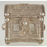 A SMALL FILIGREE BOX, with hinged lid, 7.5cm wide, 8cm high.