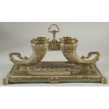 A CHINESE BRASS INKWELL ON RECTANGULAR BASE, 30.5cm long.
