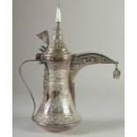 AN ISLAMIC SILVER EWER, with hinged cover and strapwork handle, curving spout, all with embossed and