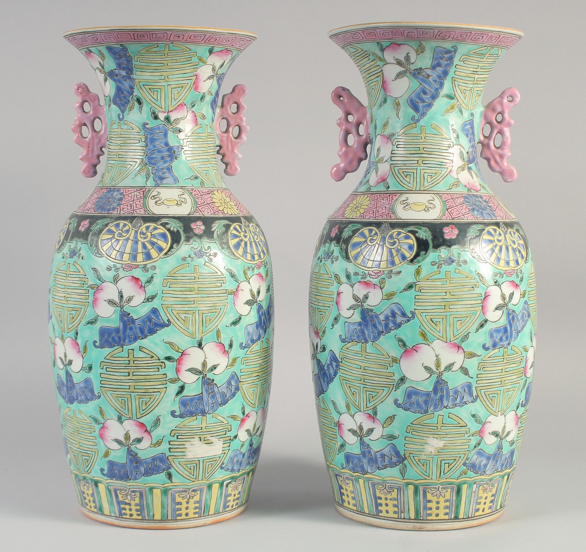 A LARGE PAIR OF CHINESE FAMILLE ROSE PORCELAIN VASES, each decorated with Shou symbols, peach and