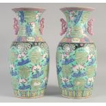 A LARGE PAIR OF CHINESE FAMILLE ROSE PORCELAIN VASES, each decorated with Shou symbols, peach and