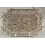 A VERY FINE 19TH CENTURY INDIAN KUTCH SILVER TRAY, with a panel of embossed and chased animals,