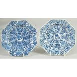 A SMALL PAIR OF CHINESE KANGXI BLUE AND WHITE PORCELAIN OCTAGONAL DISHES, painted with panels of