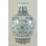 A FINE CHINESE DOUCAI PORCELAIN VASE, decorated with fine foliate scrolls and floral motifs, the