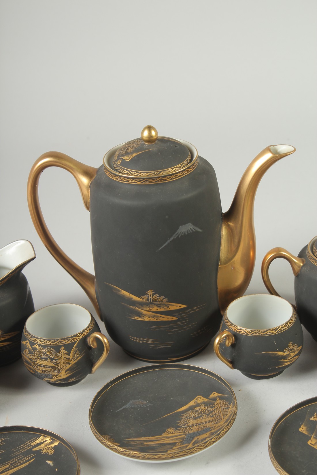 A GOOD JAPANESE BLACK AND GILT PORCELAIN TEA SET, comprising teapot, jug, sugar bowl, and six cups - Image 5 of 6